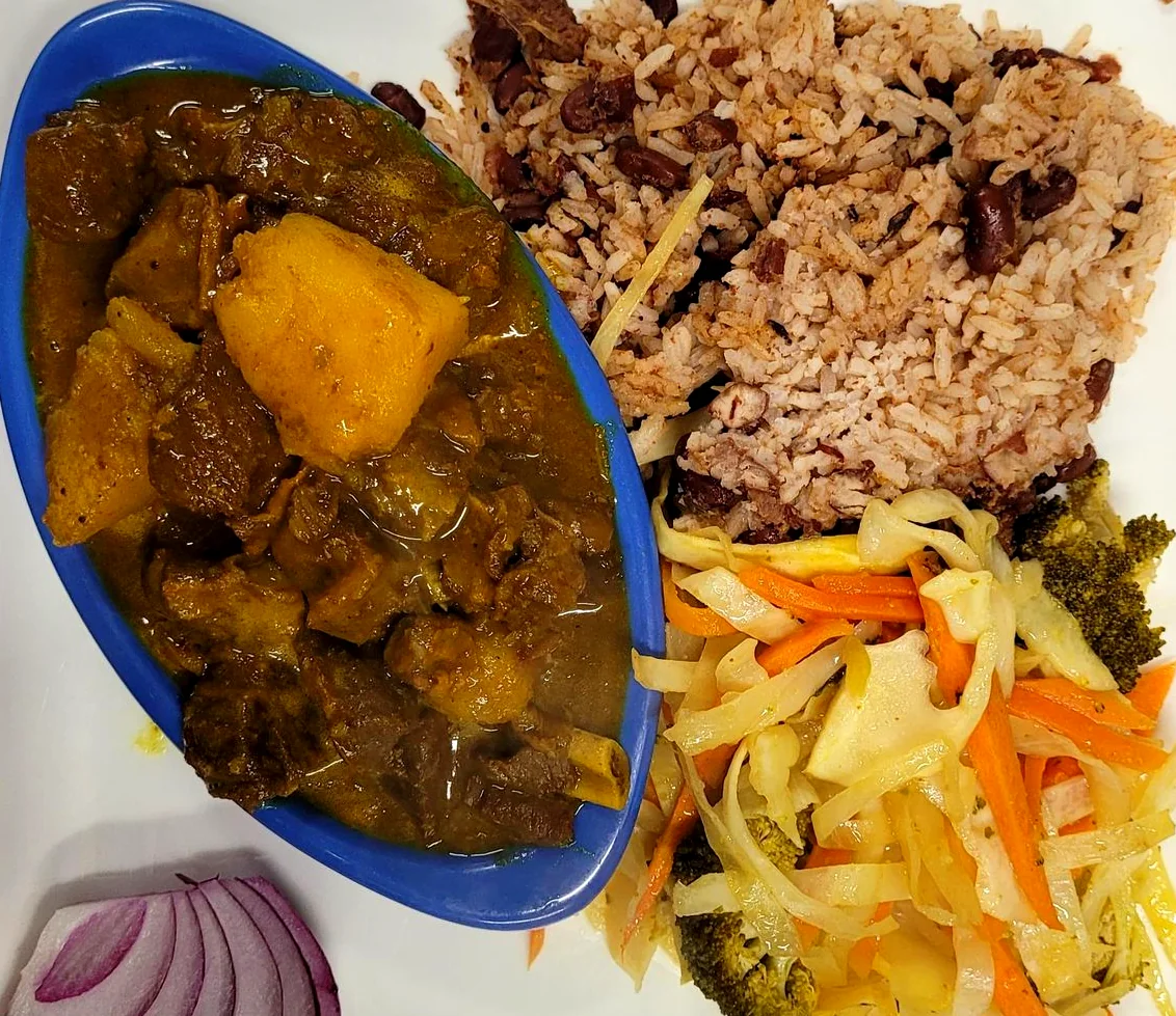 Curry chickpeas with rice and peas and steamed cabbage